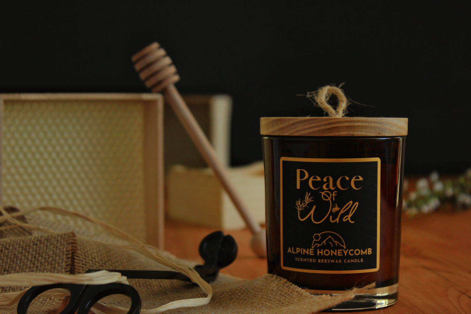 Amber glass candle jar with wooden lid. Scented candle. Made from 100% pure NZ beeswax. Wood wicks. Manuka seed dust cover. Natural and eco - friendly.